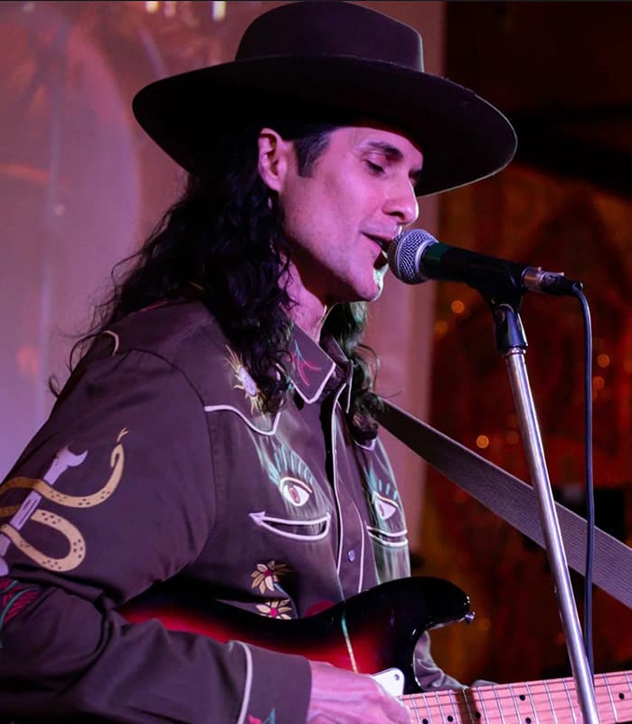 Palo Xanto performing live on guitar, photographed by Mandy Sanchez